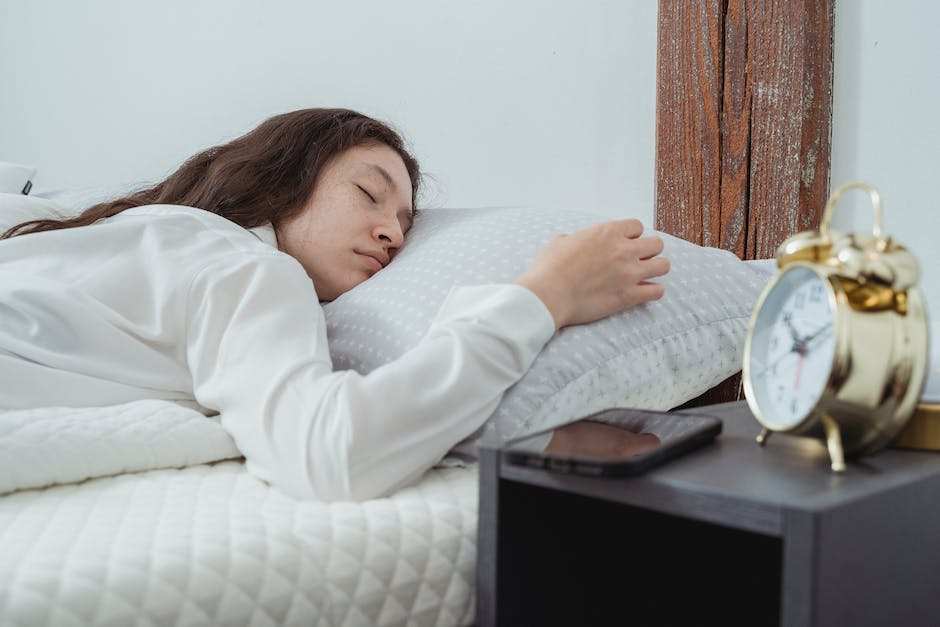 A person sleeping peacefully in a comfortable bed