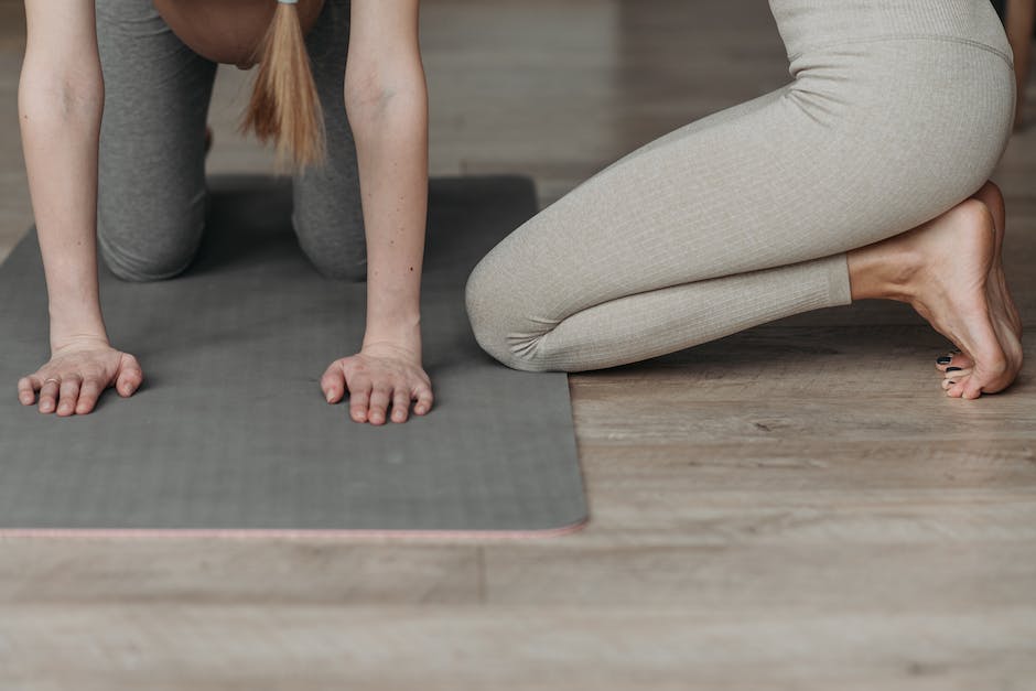 Image of a pregnant woman exercising with a personal trainer