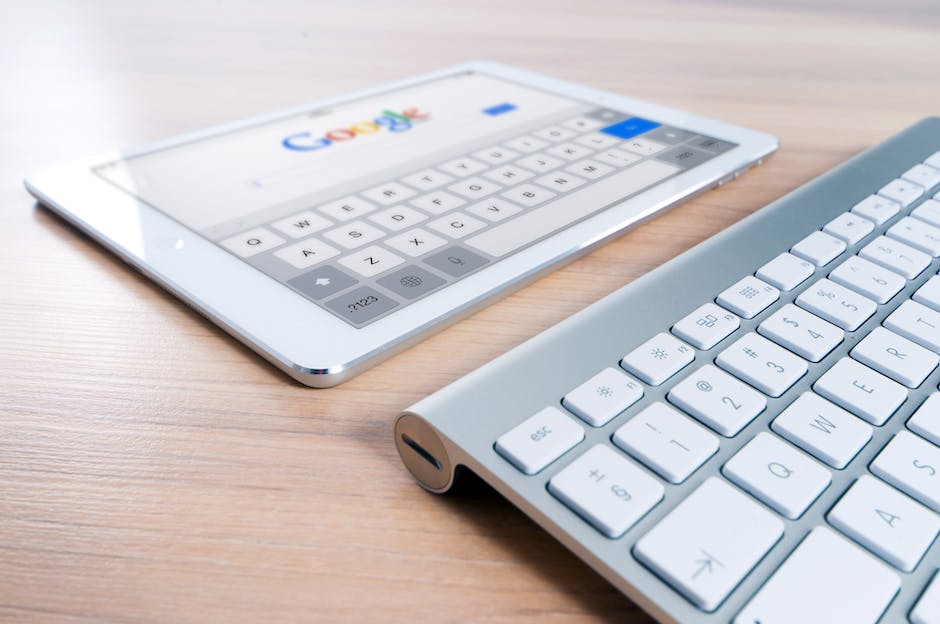 Illustration showing a magnifying glass on top of a laptop screen with website analytics data, representing SEO strategy.